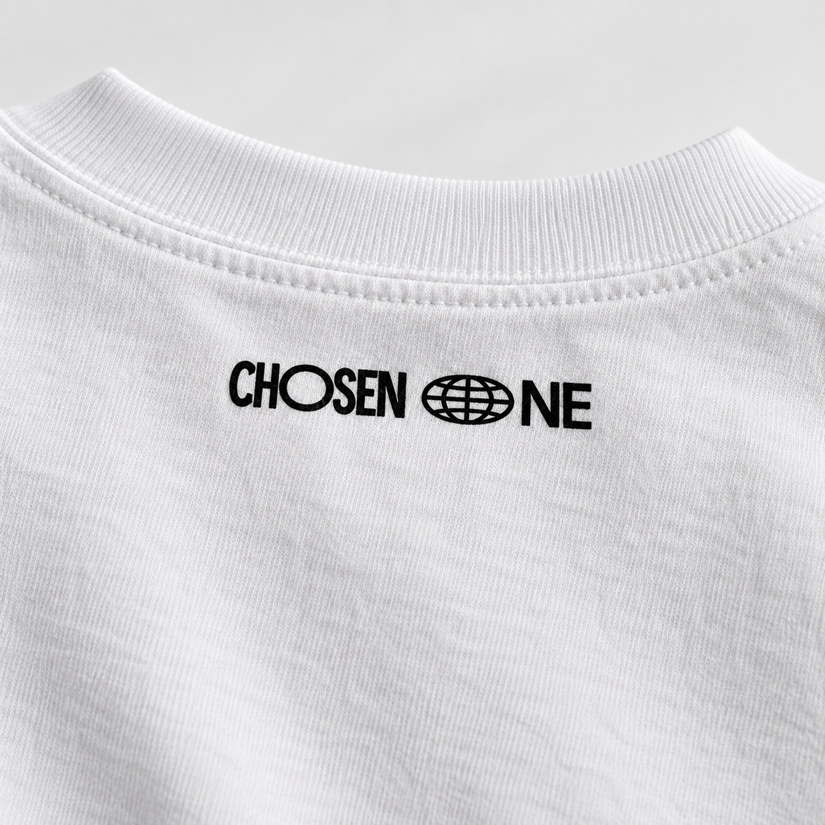 All We Need T-Shirt — collar with Chosen One logo